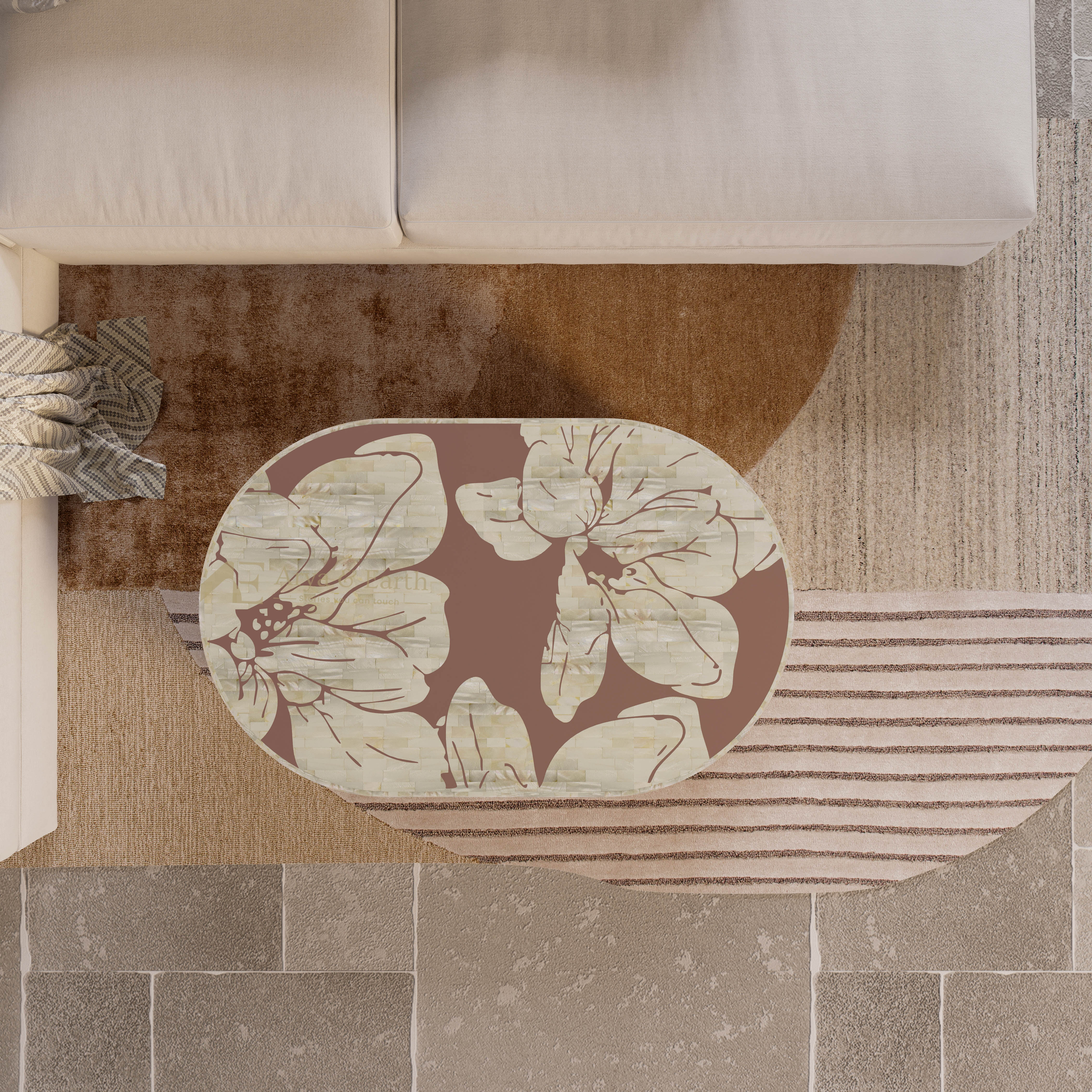 Floral mother of pearl coffee table in terracotta colour on a neutral coloured rug