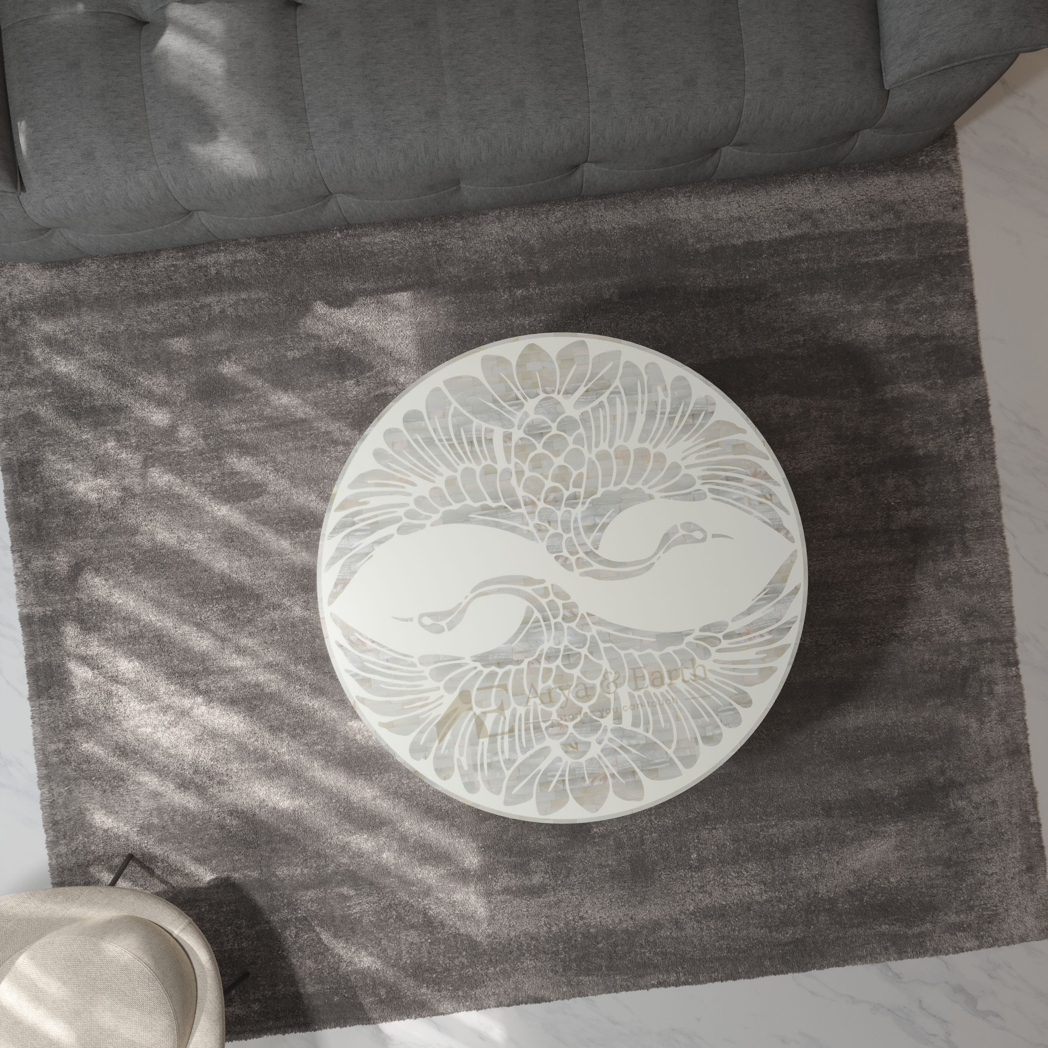 white pearl inlay pheonix design coffee table on a rug