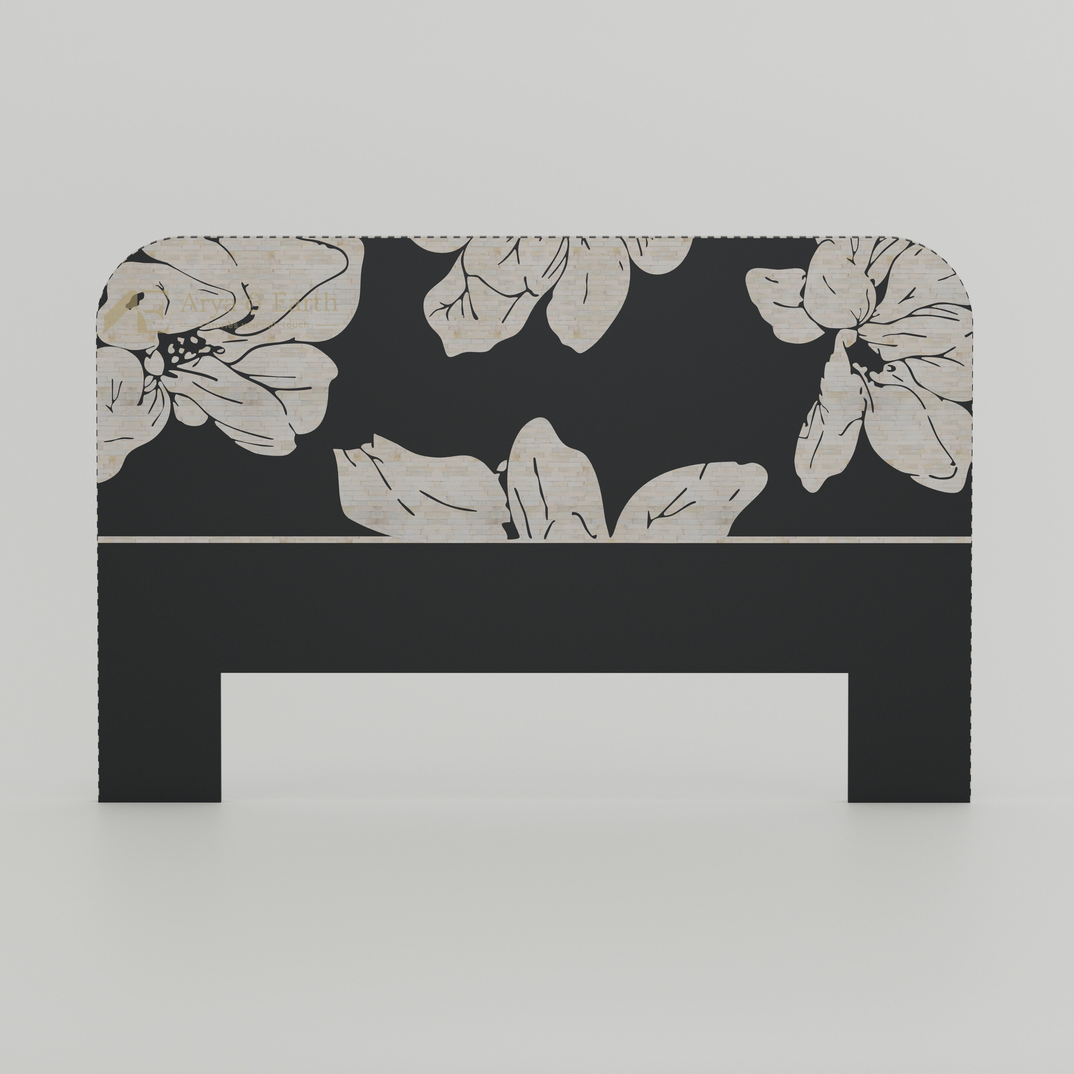 Black headboard with floral pattern on a white background