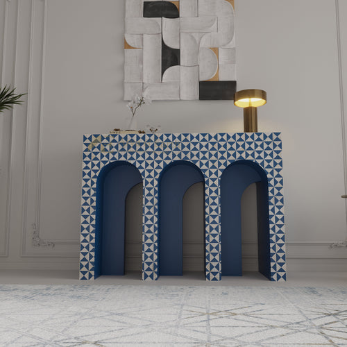 Bone inlay arched console with blue and white geometric pattern in a room with abstract wall art.