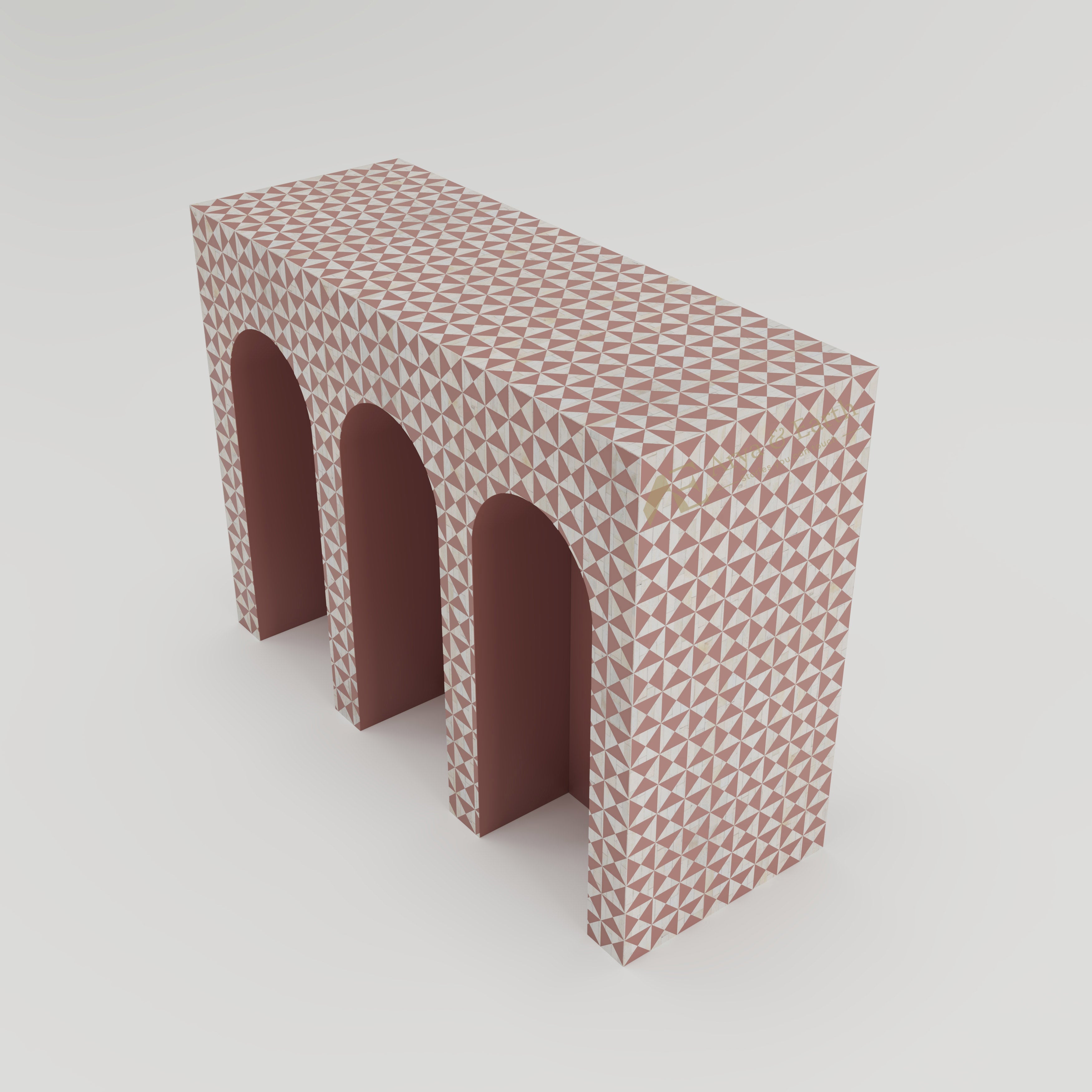 top view of bone inlay arched console table with terracotta geometric triangular pattern.