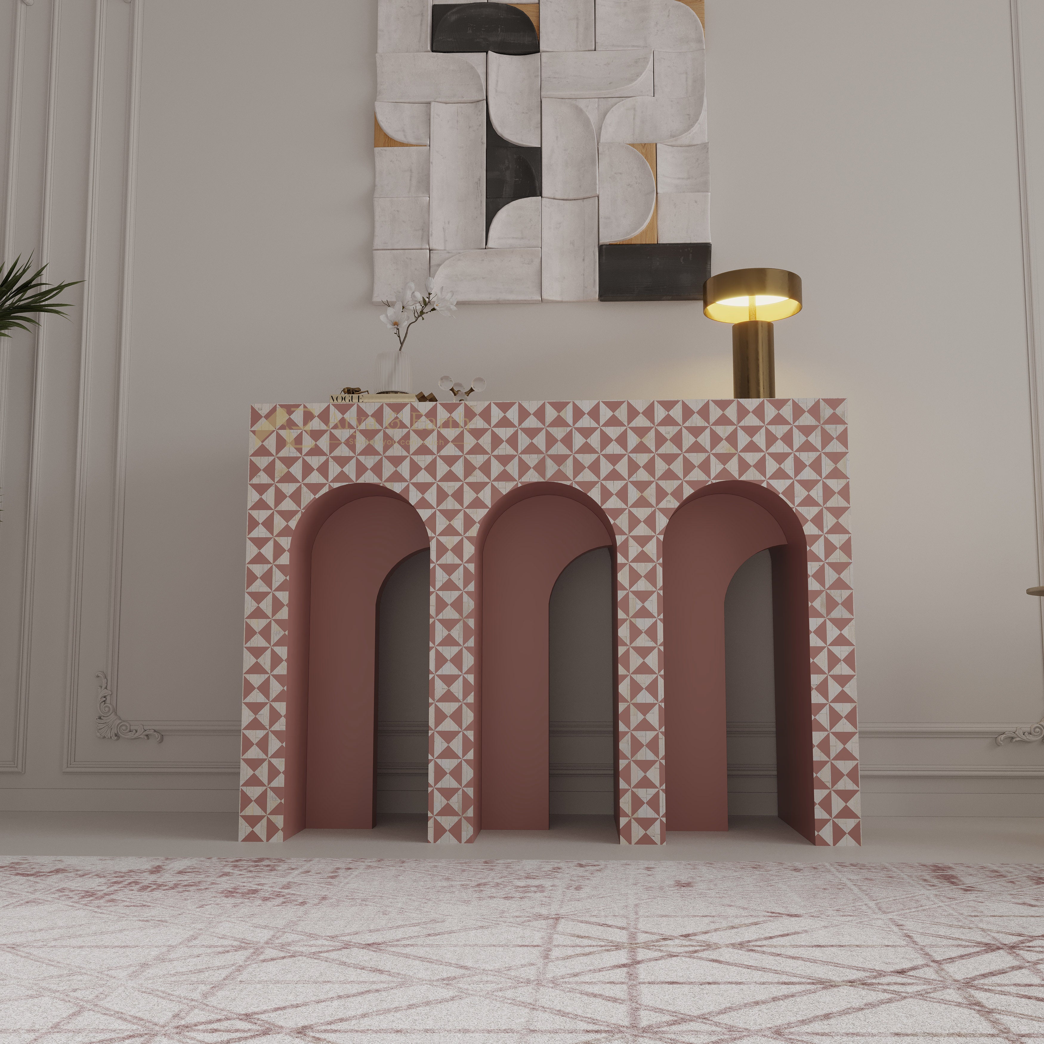 Terracotta colour hallway table with geometric pattern in a room with a lamp and a wall art.